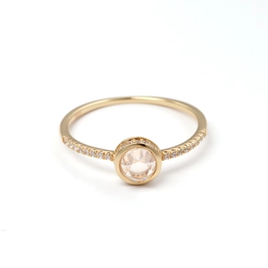 Elegant 18K gold plated ring featuring a round pink crystal stone and diamond accents