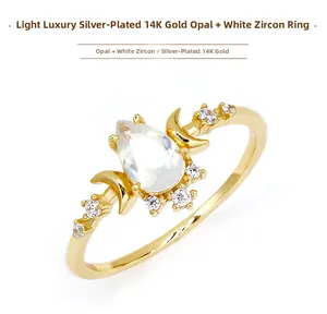 Macro detail of S925 silver ring with 14K gold plating, opal and white zircon
