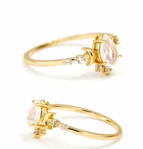 Detailed view of S925 sterling silver stamp and water drop opal stone on gold ring
