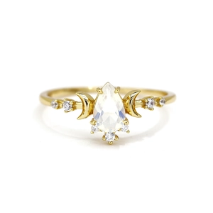 Elegant gold S925 silver ring featuring pear-shaped opal and crescent moon accents