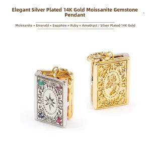 Detail of silver and 14K gold plated book pendants with emerald, sapphire and ruby inlay