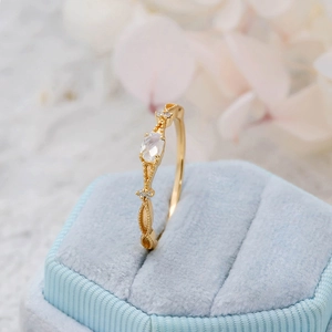 Macro detail of S925 silver gold-plated ring with marquise natural moonstone in box
