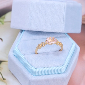Elegant S925 silver ring with large oval rose quartz in a blue velvet jewelry box