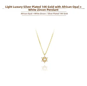 Makroaufnahme von 14K vergoldetem Silberstern-Anhänger mit Opal und Zirkonia