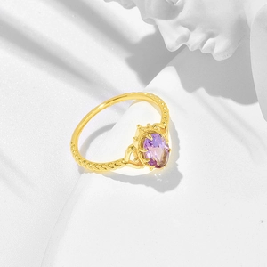 Luxurious gold crown ring with oval purple amethyst and vintage twisted band design
