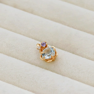 Ciondolo a fiore vintage in argento dorato 14K con topazio azzurro e ametista viola