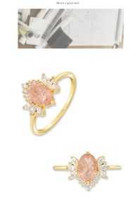 Macro detail of S925 silver ring with oval pink strawberry quartz in a floral gold setting