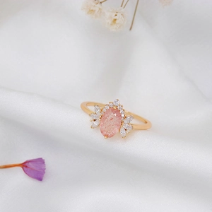 Macro detail of S925 silver ring featuring pink strawberry quartz and marquise zircons