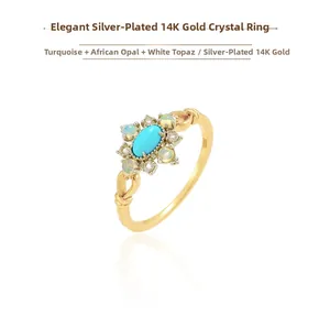 Detail of S925 silver ring with blue turquoise, African opal, and white topaz stones