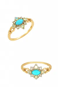 Detail of vintage S925 silver ring with turquoise, opal, and intricate gold textures