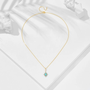 Detailed close-up of retro S925 gilded necklace with turquoise and opal stones