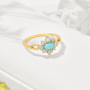 Macro view of vintage S925 silver ring with turquoise and opal stones in gold finish