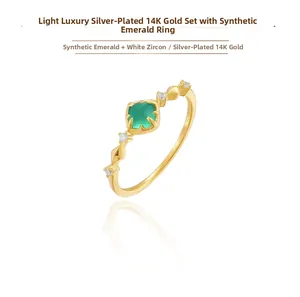 Detailed view of S925 silver 14K gold plated ring with emerald and white zircon