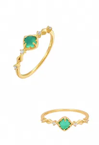 Detail view of S925 sterling silver gold-plated ring with square cut green emerald stone
