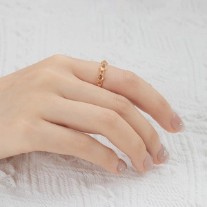 Macro shot of 14K gold plated silver ring with three olive-cut yellow citrine gems