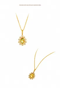 Makrodetail des bernsteinfarbenen Blumenanhängers mit Perlen und Zirkonia in 14K Gold