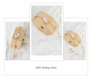 Detail of gold-plated S925 sterling silver bracelet with white moonstones and zircon