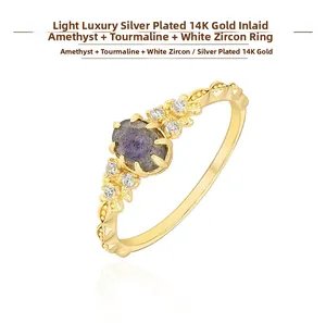 Close-up of 14K gold plated silver ring featuring iolite, labradorite and zircon gems