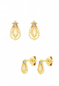 Close-up of S925 sterling silver gold-plated retro earrings with white opal and purple stones