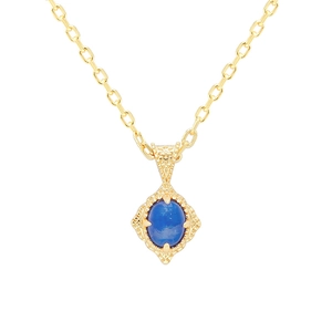Vintage gold necklace with oval blue gemstone pendant and hollow floral relief pattern