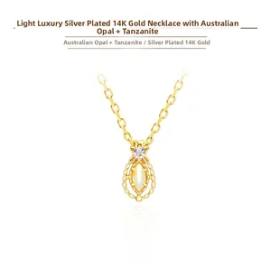 Close-up of marquise Australian opal and tanzanite pendant on 14K gold-plated silver chain