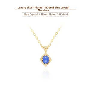 Detail of 14K gold plated silver necklace with vintage rhombic kyanite pendant