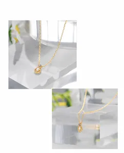 Exquisite 14K gold plated water drop necklace with white pearl and purple gemstone detail