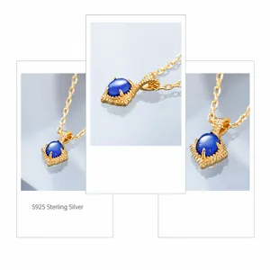 Detailed macro view of S925 silver necklace with blue gemstone and vintage flower pattern