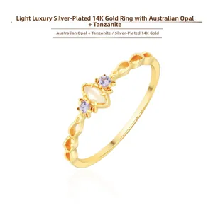 Macro shot of 14K gold plated silver ring with Australian opal and tanzanite stones