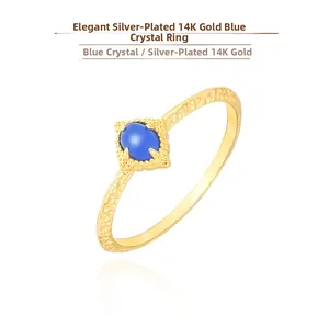 Detail of S925 silver ring with 14K gold plating, oval kyanite, and hammered texture
