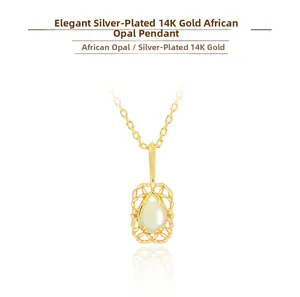 Close-up of a pear-shaped African opal pendant set in a 14K gold-plated silver floral base