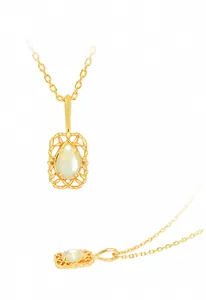 Detailed view of teardrop opal pendant in 14K gold plated hollow lace frame