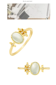 Detail of vintage gold plated S925 silver ring with oval prehnite and white zircon accents