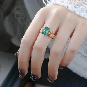 Detailed macro view of vintage S925 silver ring with green malachite and rutilated quartz