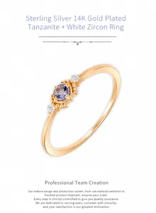 Macro shot of 14K gold plated silver ring featuring a purple tanzanite and white zircons