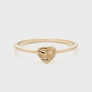 Detailed macro view of 14K gold plated ring with double-sided heart and handshake relief