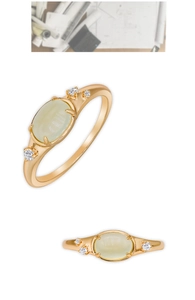 Detailed view of an oval light green prehnite ring set in 14K gold plated S925 silver