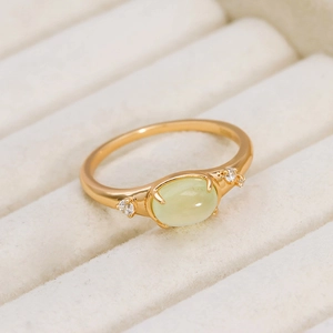 Detailed macro view of S925 hallmark on gold plated prehnite and zircon ring