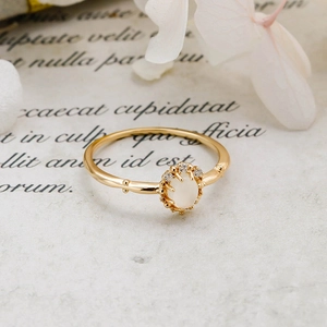Macro shot of 14K gold plated silver ring with oval moonstone and white zircons