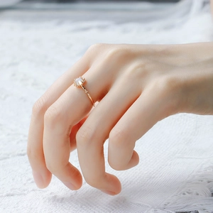 Detail of S925 silver 14K gold plated ring with moonstone and white zircon on model