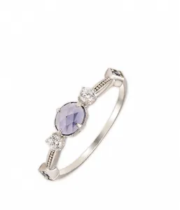 Detailed view of S925 silver 14k gold plated ring with oval iolite and blue corundum