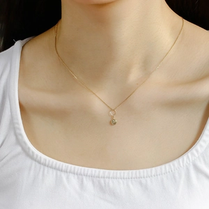 Minimalist 14K gold-plated S925 silver necklace with small embossed round pendant on model