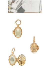 Macro detail of French vintage 14k gold plated S925 silver locket with faceted gemstone