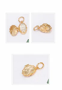 Detail of vintage gold plated S925 silver locket pendant with milky prehnite gemstone