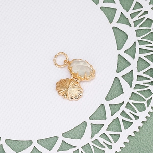 Detail of vintage 14k gold-plated silver pendant with oval rose-cut moonstone