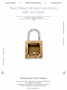 Detailed view of S925 silver 14K gold lock pendant with smoky quartz and floral engraving