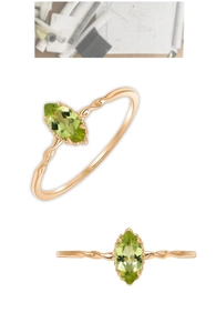 Detailed view of marquise-cut green olivine ring with twisted 18K rose gold band