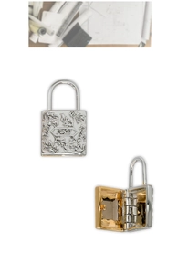 Macro detail of vintage S925 silver lock pendant showing 2023 engraving and open hinge