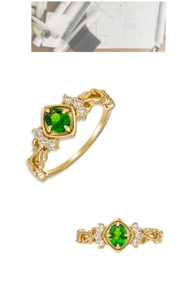 Detailed side view of vintage S925 silver 14K gold ring with green diopside and filigree