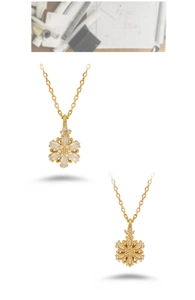Detaillierte Vorder- und Rückansicht einer goldene Schneeflocke-Halskette mit Zirkonia